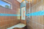 Beautiful and serene shower with amazing tile work 